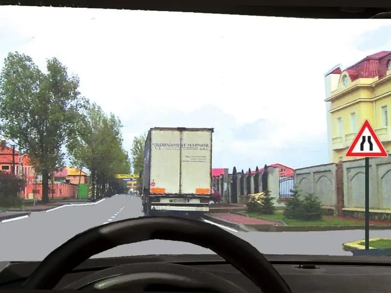 Camionul este staţionat. Cine încalcă legea dacă încercaţi să-l depăşiţi ?